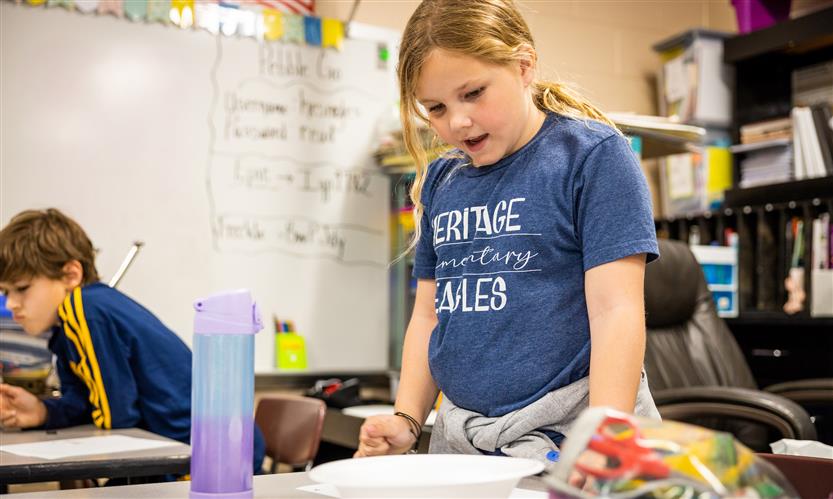 Students create compasses in science class